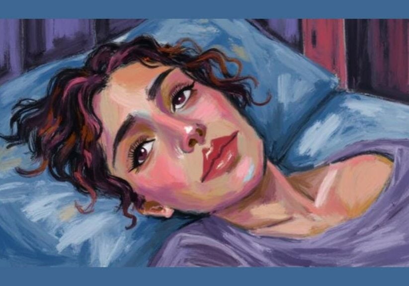 Person lying awake at night after waking at 3am