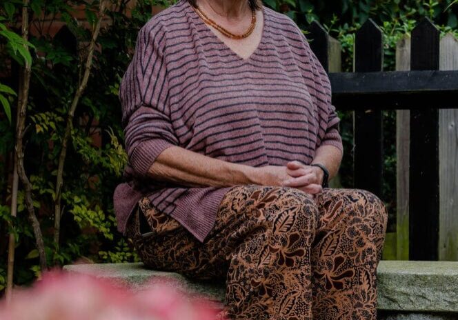 Sue Meditating in a Japanese garden