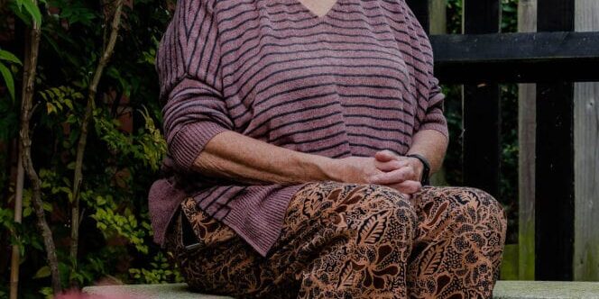Sue Meditating in a Japanese garden