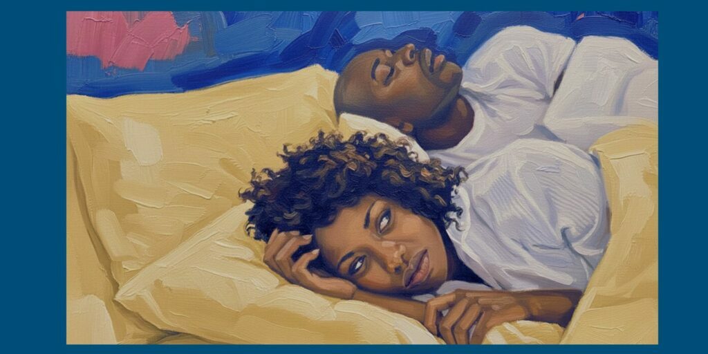 Woman lying awake in bed while her partner snores, showing how snoring can disturb sleep at night. One thing that can lead to sleep divorce.